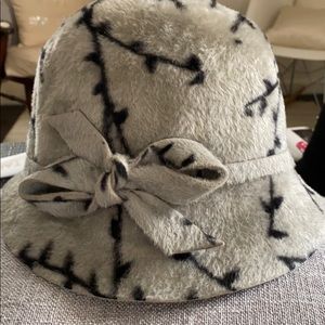 Kathy Jeanne gray and black bowler hat.